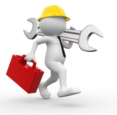 Figura de un trabajador con casco, llevando herramientas y una maleta roja.